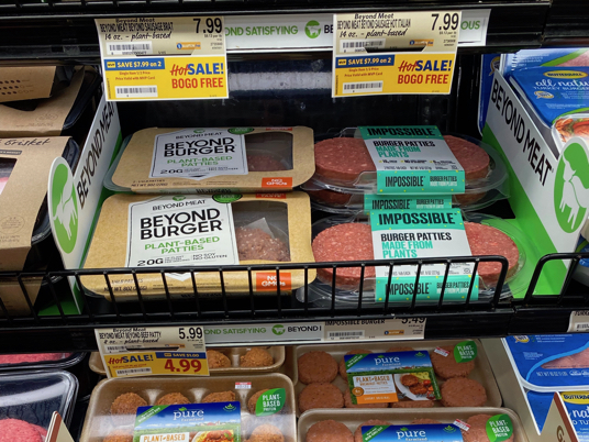 Photo of alternative meat packages on sales in the retail meat case.