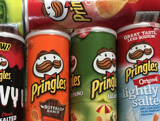 Shot of Pringles cans on a retail shelf