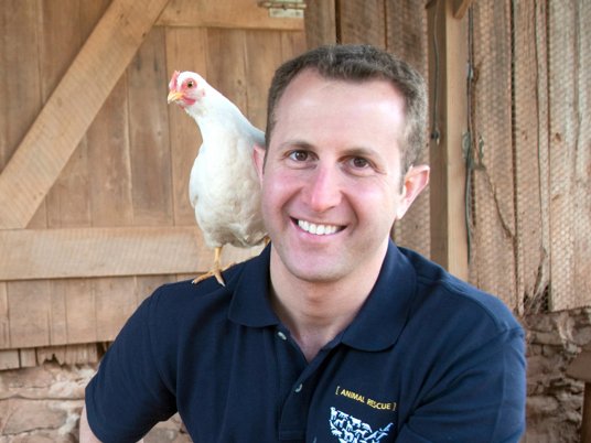 Paul Shapiro with a chicken on his shoulder