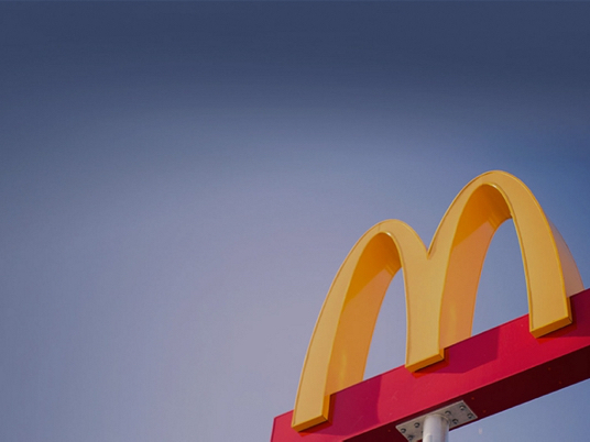 McDonald's iconic golden arches against a blue sky